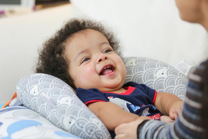 Julian with his mother at an EI home visit.