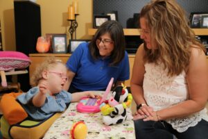 Amelia and mother Shelly having an Early Intervention home visit with Developmental Specialist Melinda Ciccarelli.