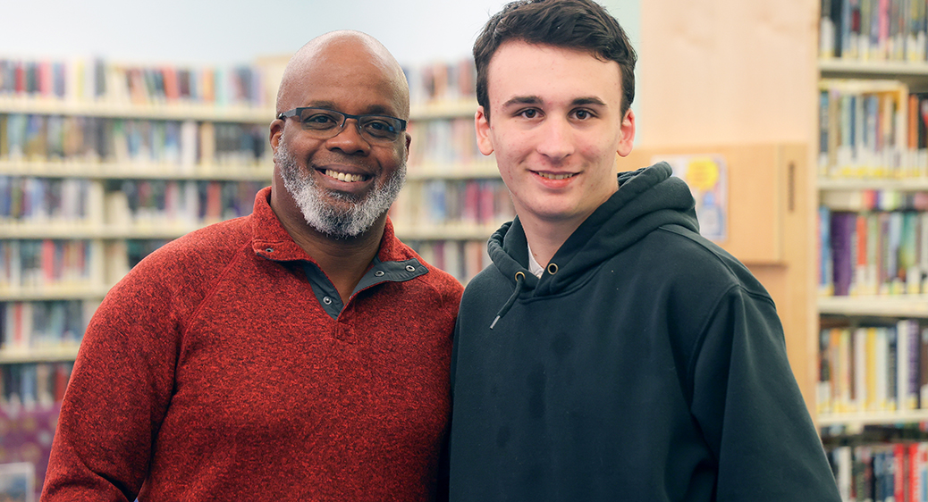 Photo of a young man named Max and his team of developmental disabilities professionals.