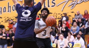 Special Olympics athletes playing a basketball game against Summit DD staff.
