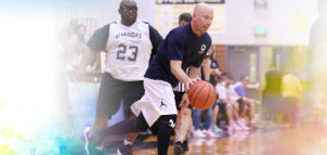 Special Olympics athletes playing a basketball game against Summit DD staff.