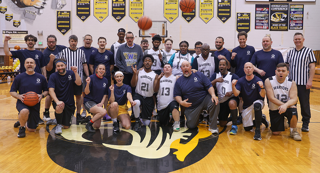 Special Olympics athletes playing a basketball game against Summit DD staff.