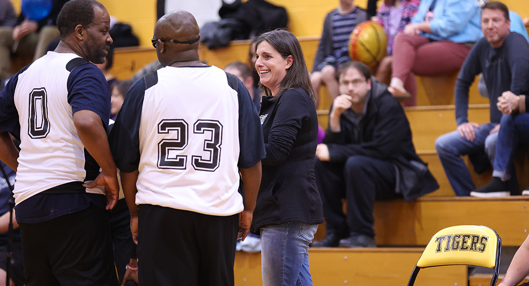 Special Olympics athletes playing a basketball game against Summit DD staff.