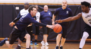 Special Olympics athletes playing a basketball game against Summit DD staff.