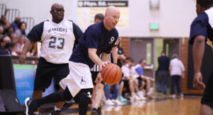 Special Olympics athletes playing a basketball game against Summit DD staff.