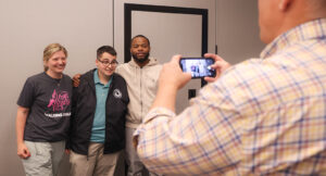 Cainan, emerging leader program graduate, posing for a photo with friends.