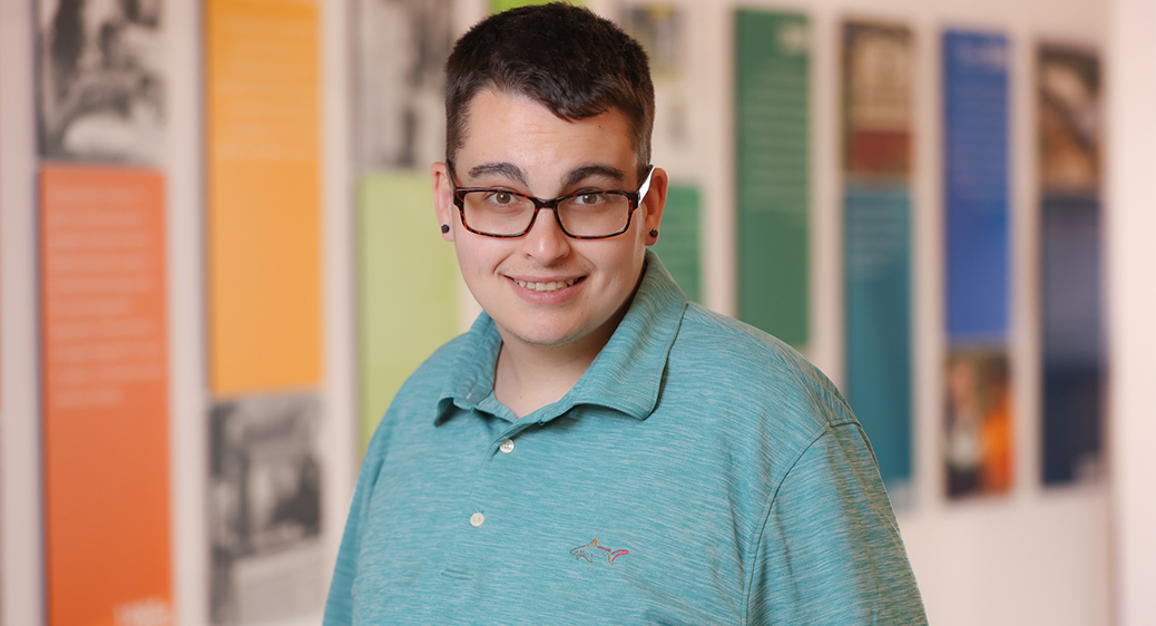 Cainan, emerging leader program graduate, posing for a photo indoors.