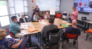 Emerging leader participants working together at a large table.