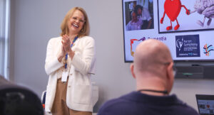 Lynnette Klejka, Summit DD staff, speaking to Stewart, a program participant.