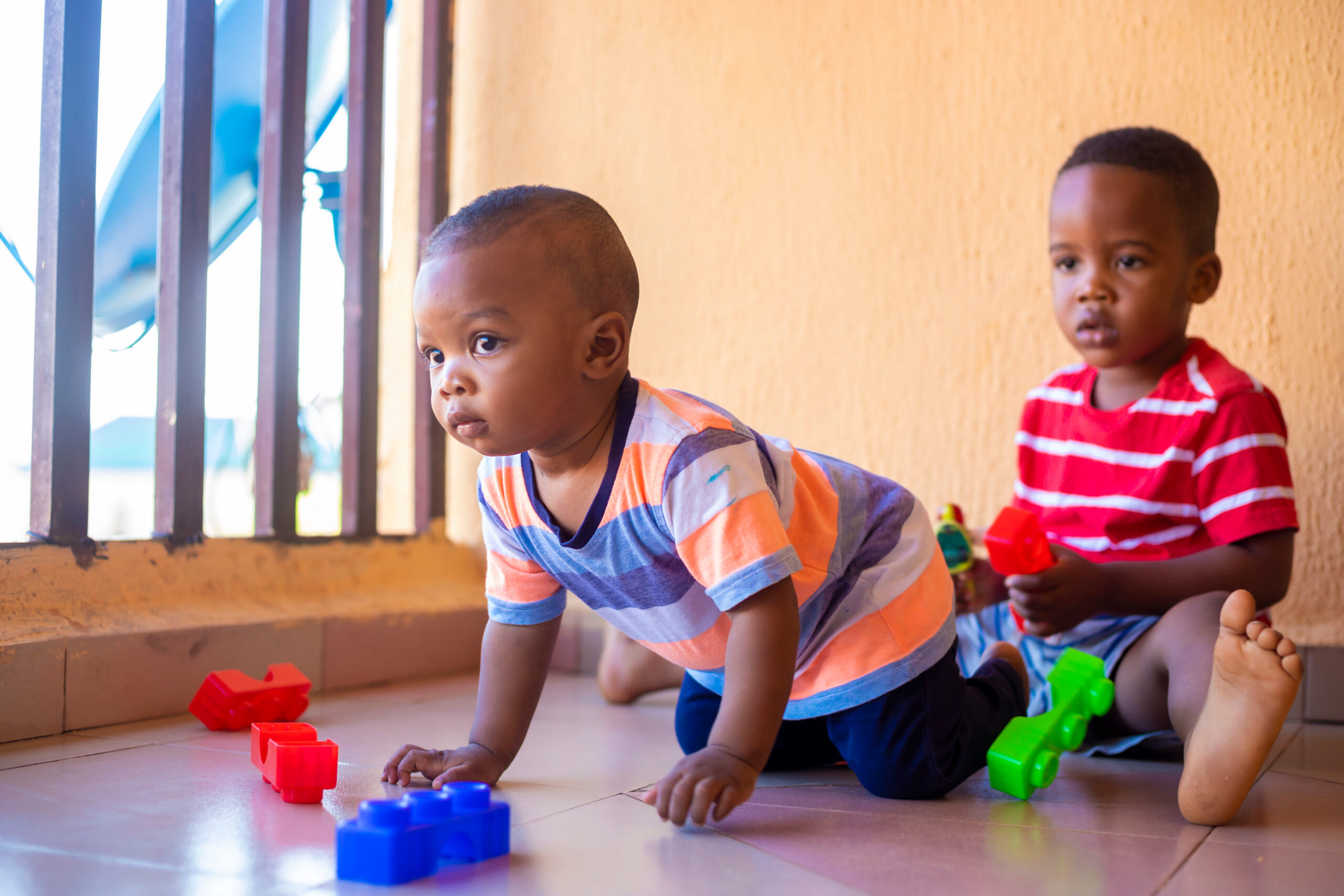 young boys playing creative toy blocks for homeschooling
