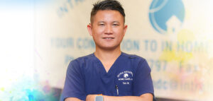 Yam teaching sign language at Intra-National Homecare.