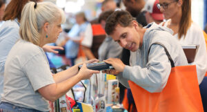 An individual exploring tech options at the tech expo.