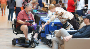 An individual exploring tech options at the tech expo.