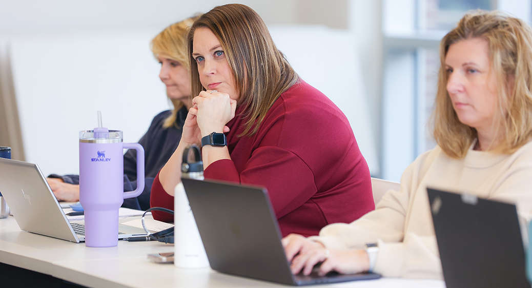 A member of the Intensive Treatment Team speaking during a team meeting.