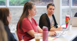 A member of the Intensive Treatment Team speaking during a team meeting.