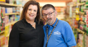 Portrait of an Acme employee, Scott, with his Summit DD SSA Julie.