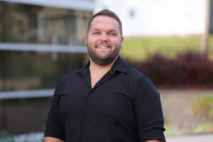 Portrait of new staff person Cody Bauer.