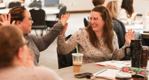 Summit DD staff high diving during the autism training day event.
