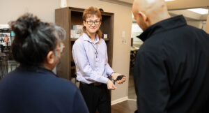 Photo of Evan providing a tour of the Summit DD Smart Home.