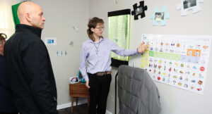 Photo of Evan providing a tour of the Summit DD Smart Home.