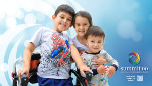 Children smiling in front of blue background