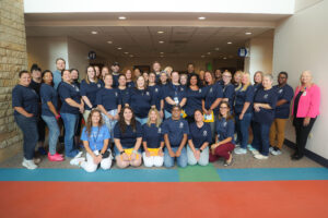 Large group of people smiling.
