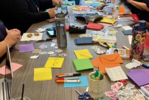 Close up of arts and craft supplies on a table.