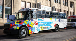Photo of the Summit DD Sensory Bus parked outside of Summit Artspace.