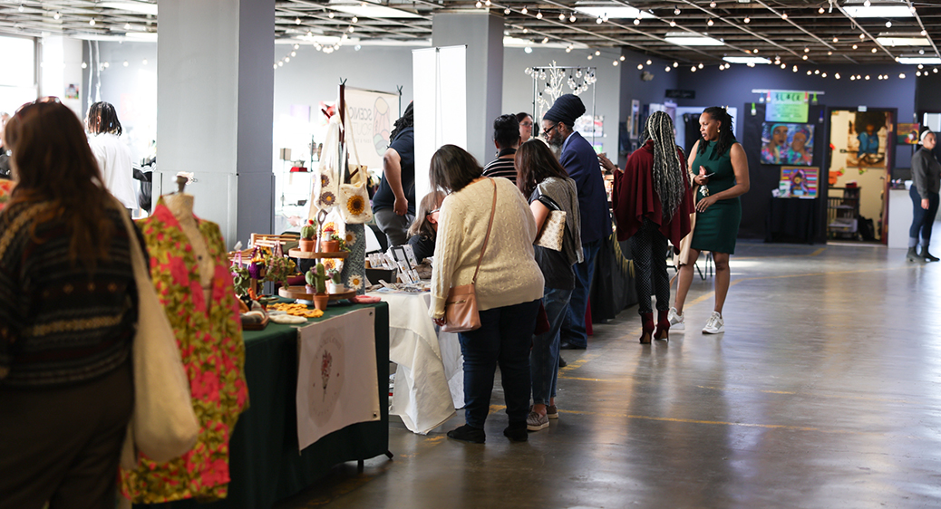 Photo of community members shopping booths at the Summit Art Walk.