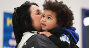 Child and mother participating in Music Therapy class.
