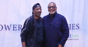 Community members posing for a group photo at the Special Olympics vs Summit DD game.