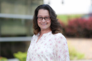 Outdoor portrait of new Summit DD team member Jackie Sadler.