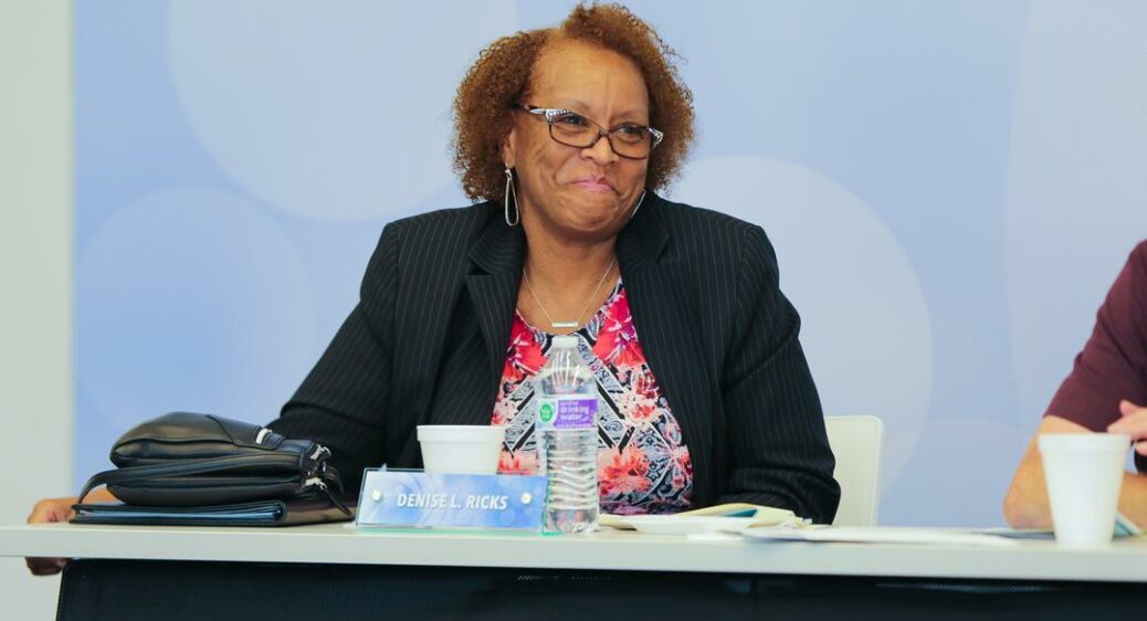 Summit DD Board Member Denise Ricks smiling during meeting