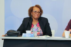 Summit DD Board Member Denise Ricks smiling during meeting