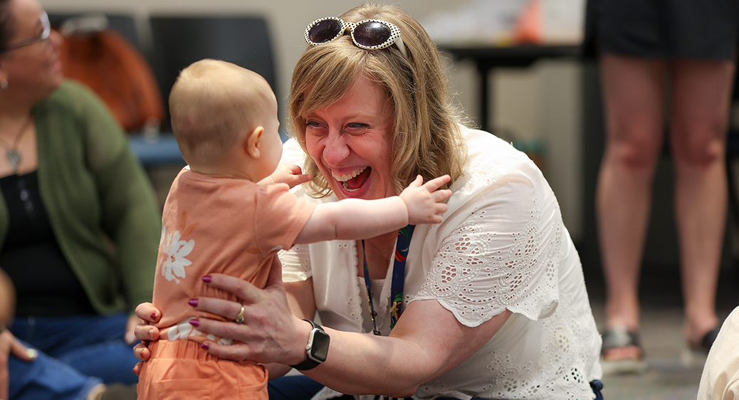 Summit DD team member playing with a child at the Speech Language Pathology Playgroup.
