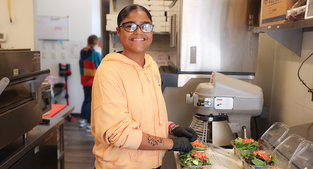Smiling teen working at a local drive-thru restaurant for the Summer Youth program.