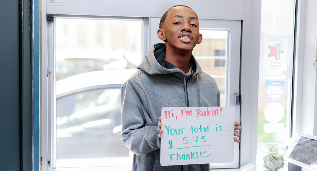 Smiling teen working at a local drive-thru restaurant for the Summer Youth program.