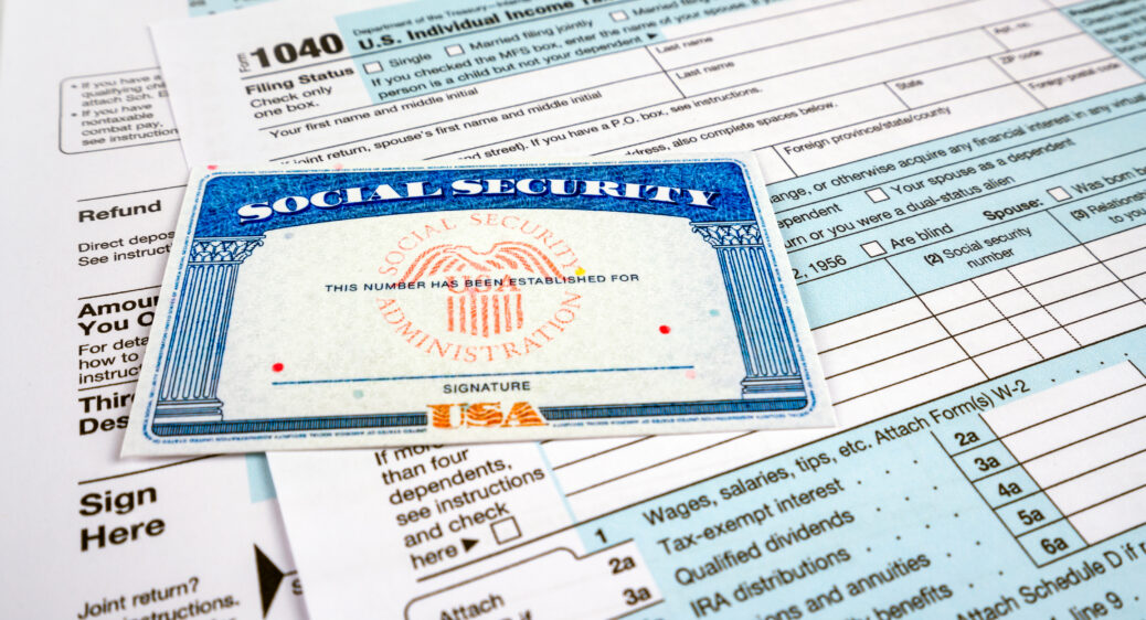 Blank social security card, and 1040 us individual tax income return form.