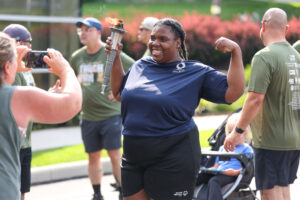 Smiling, African-American Special Olympic Athlete posing for her photo after completing the Special Olympics Torch Run