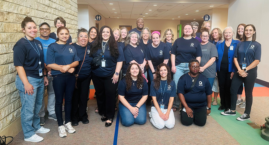 Group photo of Summit DD employees volunteering in the community.
