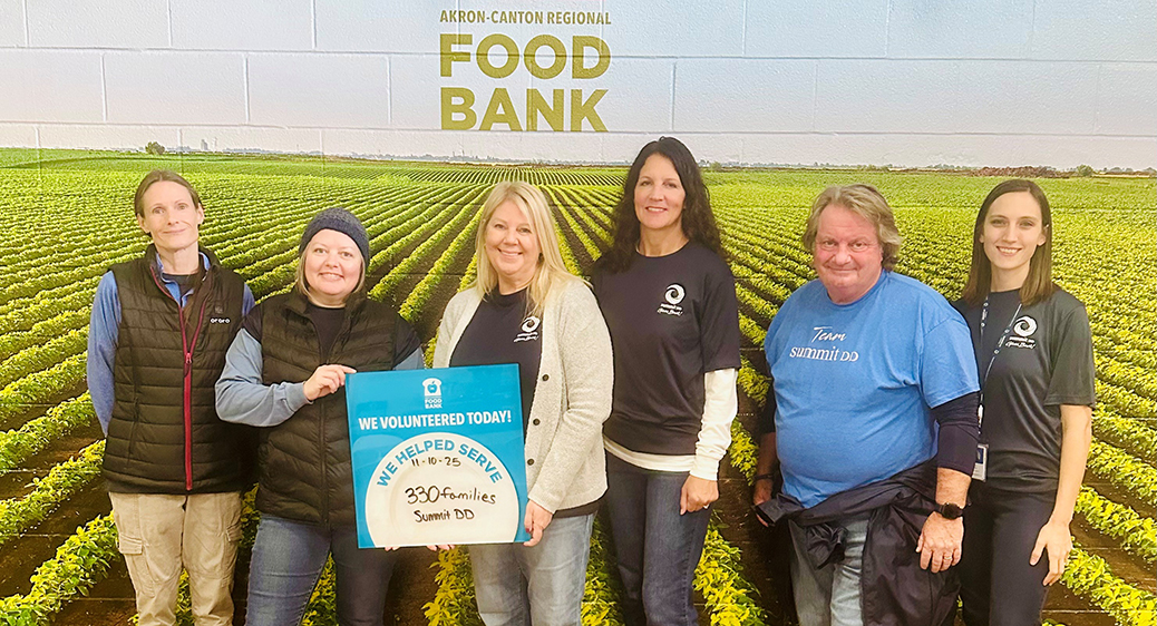 Group photo of Summit DD employees volunteering in the community.