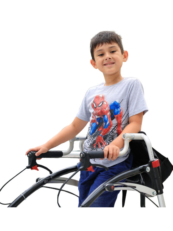 School-age boy using a gait-trainer and smiling for a photo
