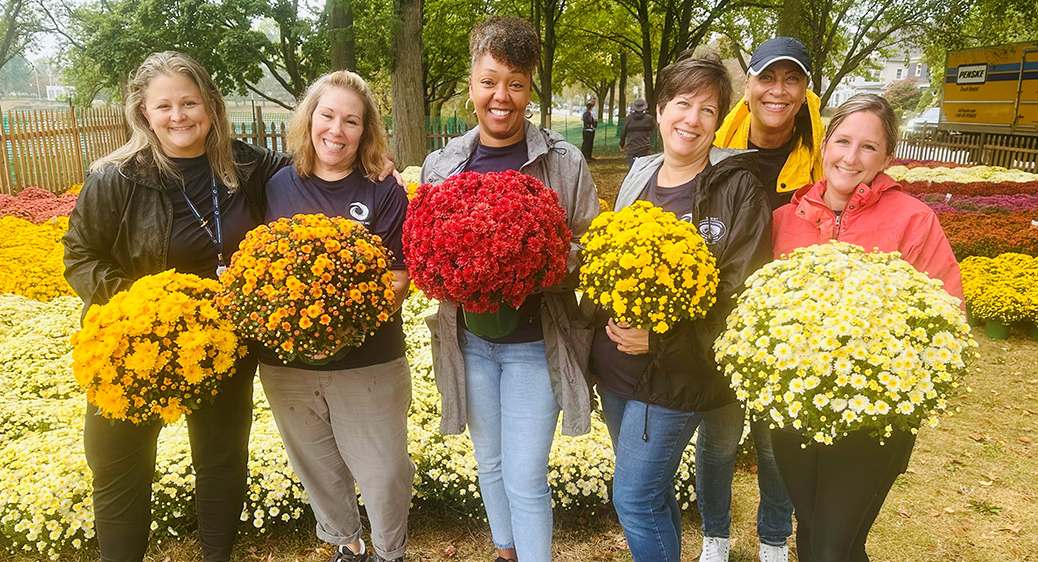 Group photo of Summit DD employees volunteering in the community.