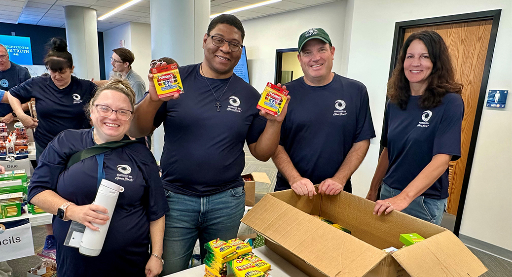 Group photo of Summit DD employees volunteering in the community.