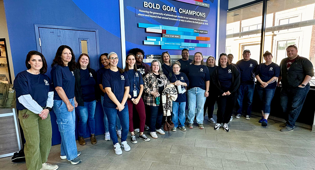 Group photo of Summit DD employees volunteering in the community.