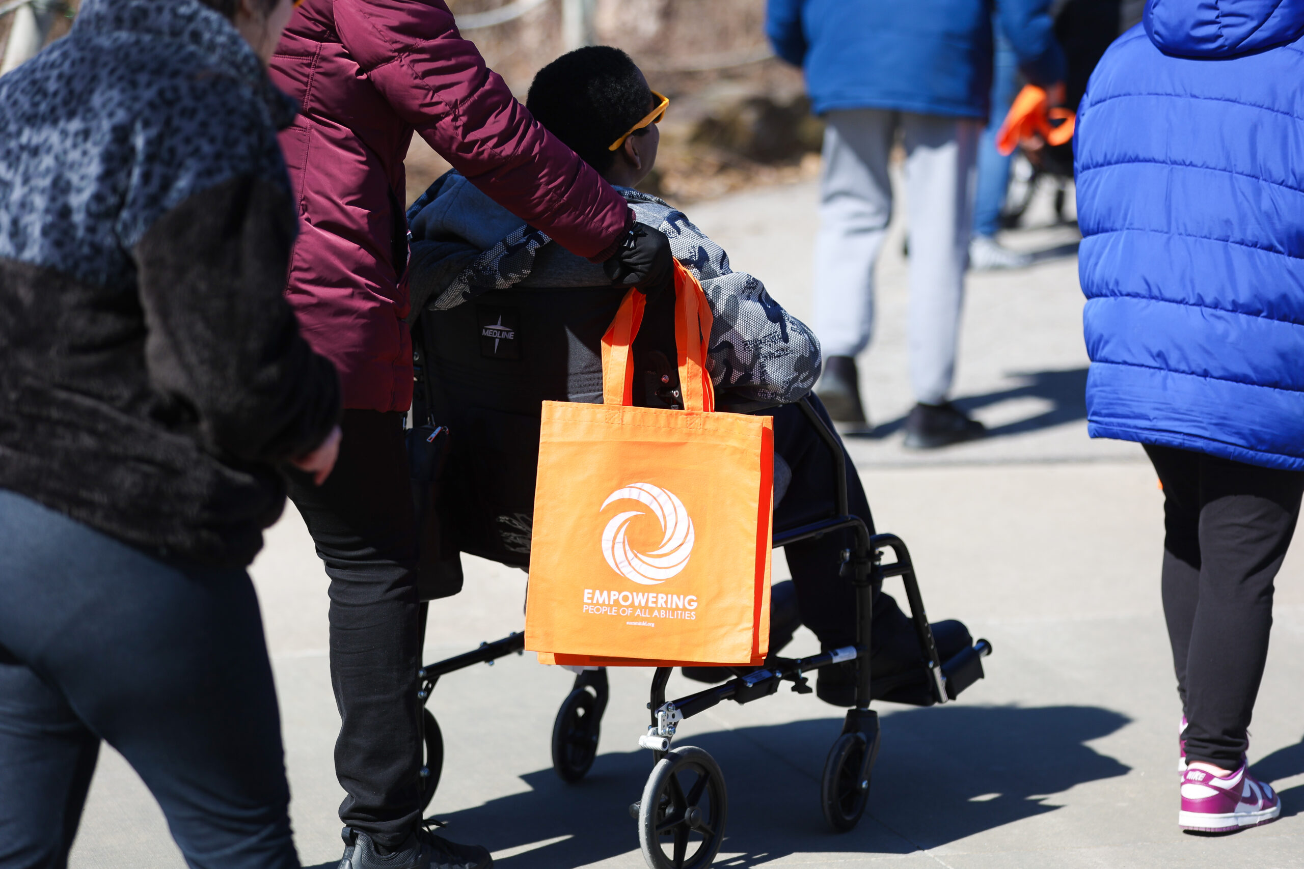 Person who uses a wheelchair is visiting the zoo.
