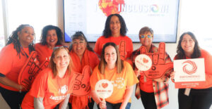 Summit DD staff members holding Inclusion messages for Inclusion Day