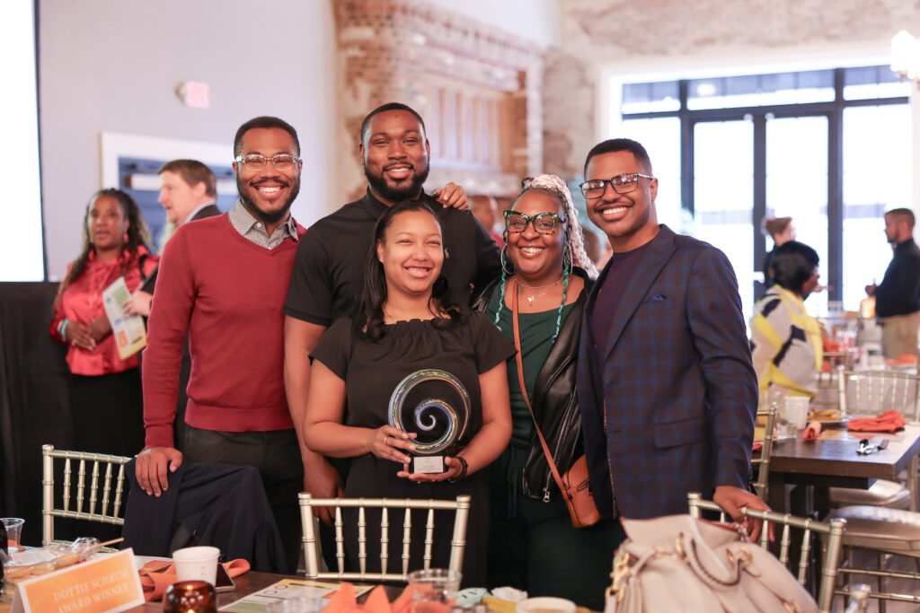 Dottie Schrum Award winners, Louisa Ridge posing for a photo holding their award
