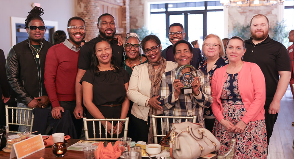 Smiling group photo of direct support professionals who won an award at Summit DD's Community Breakfast.