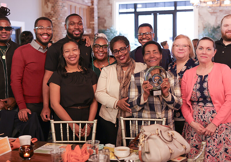 Smiling group photo of direct support professionals who won an award at Summit DD's Community Breakfast.
